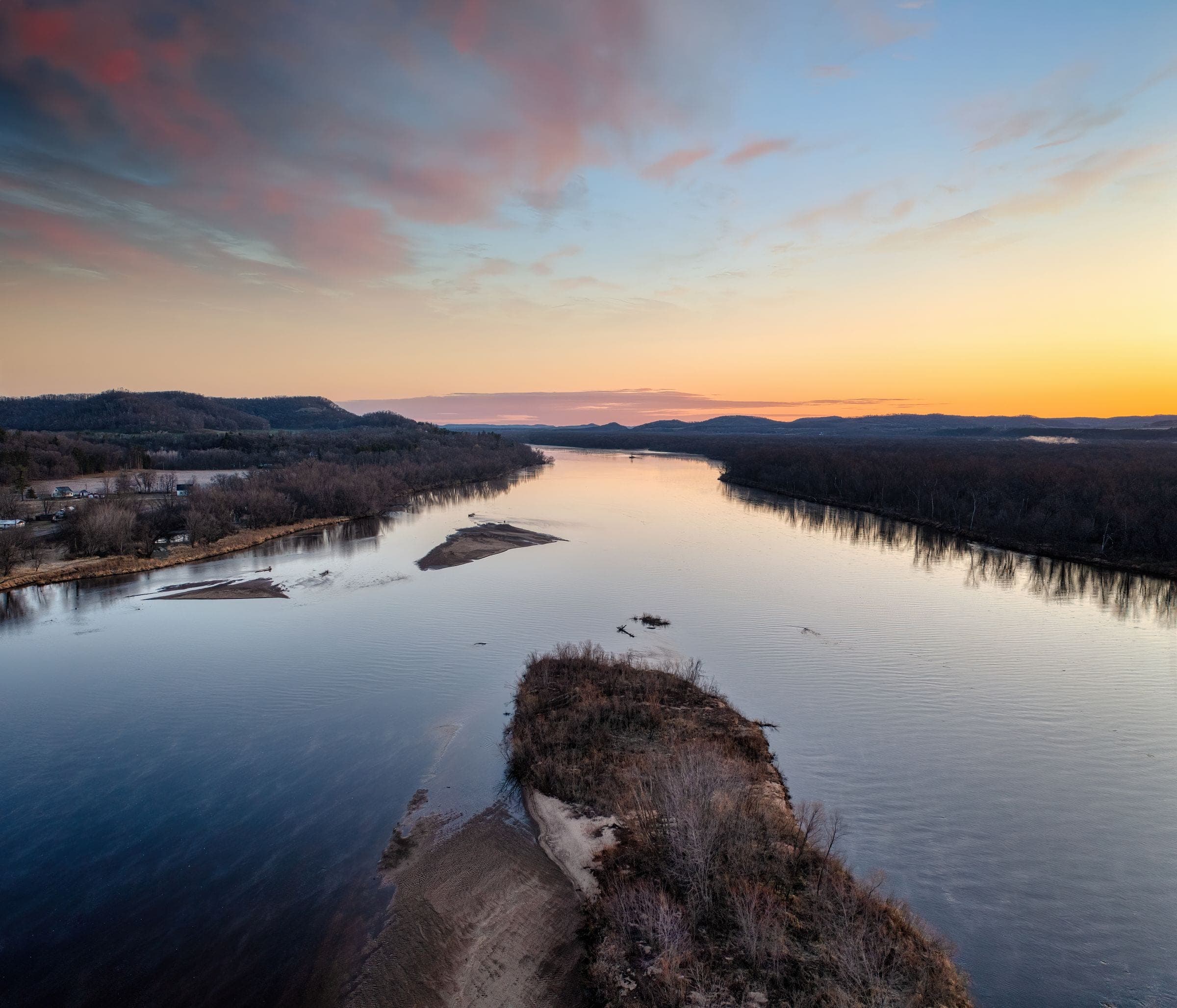 Aerial view of a wide Wisconsin river at sunset
